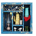 Vintage Blue Distressed Storage Cabinet With Decorative Bird Figurines Vines And Colorful Kettles