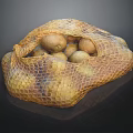 Fresh Potatoes in Mesh Bag on Black Background