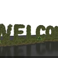 WELCOME Topiary Garden Decoration With Green Shrubs and Water Reflection in Outdoor Space