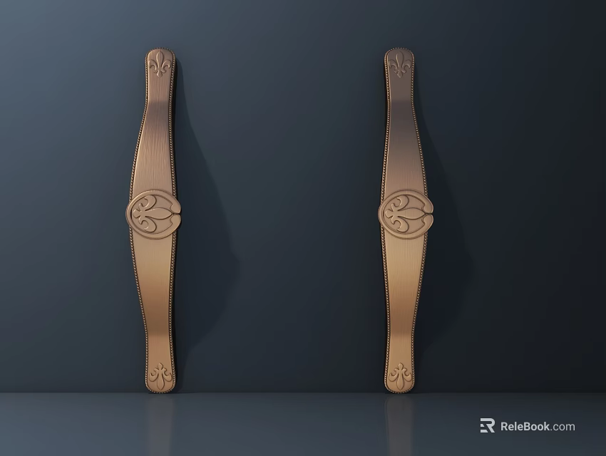 Two Decorative Brass Cabinet Handles With Ornate Patterns On Dark Wall 3d model 