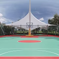 Tensile Membrane Structures Over Green Sports Court Near Red Brick Building With Trees And Cars