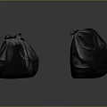 Two Black Tied Plastic Trash Bags For Household Waste Disposal