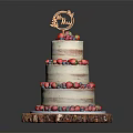 Three Tier Fresh Berry Cake With Golden Decoration On Wooden Base
