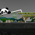 Panda Peeking Over Green Mountain Scenery with Traditional Architecture in Liupanshui Guizhou