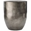Golden Metallic Vase With Curved Design And Small Decorative Metal Object