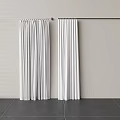 White Curtains Hanging On Rod With Light Wall And Dark Tile Floor