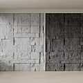 Textured Stone Wall Design with Light Gray and Dark Gray Panels for Modern Interior Decor
