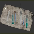 Assorted Medical Syringes Of Different Sizes With Green Plungers On Cloth