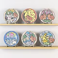 Colorful Cartoon Patterned Plates Displayed On Two Wooden Shelves For Home Decor