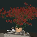 Decorative Ornament Set With Red Flowers In Vase On Linen Cloth And Small Items