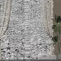 Natural Linen Curtains With Sheer Layers And Tiebacks By Potted Plant Window View