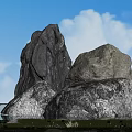 Large Natural Stones With Blue Sky White Clouds Grass And Lotus Water