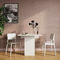White Dining Table Set With Two Chairs Pink Flowers Vase Green Plant And Wall Art