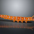 Orange Caterpillar with White and Brown Spots Shiny Surface on Smooth Surface and Reflection