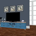 Blue TV Stand with Drawers Glass Doors TV and Decorations on Gray Wall Wooden Floor