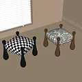 Black and white checkered and patterned stools with black and brown legs in indoor room