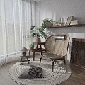 Wicker Leisure Chair with Black Cushion and Plants by Window Books on Shelf and Rug