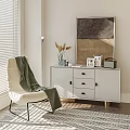 White Modern Entryway Cabinet Sideboard with Vase Photo Frames Green Blanket Chair and Sunlit Window