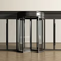 Modern Commercial Revolving Door With Glass Panels And Black Frame Entrance Design