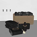 Black Bathroom Essentials Including Towels Woven Basket Soap Dish And Lotion Bottle