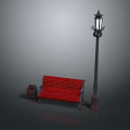Red Outdoor Bench With Street Lamp And Trash Bin In Public Area