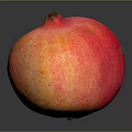 Fresh Red Orange Pomegranate With Speckled Skin On Dark Background