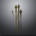 Ancient Golden Metal Weapons Collection Featuring Various Lengths And Decorative Tops