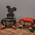 Mickey Shaped Black And Red Leisure Chairs With White Decorated Legs On Wooden Floor