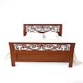 Elegant Wooden Bed With Carved Headboard Footboard White Pillows And Patterned Bedspread