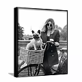 Portrait of Woman With French Bulldog in Bicycle Basket Railing Trees Black and White Style