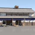 Traditional Japanese Wooden Building With Tile Roof Shop Front Signboard And Outdoor Tables