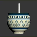 Carved Sculpture Bowl With Blue White Geometric Leaf Patterns And Silver Spoon On Smooth Surface