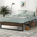 Double Bed with Metal Frame Light Green Geometric Bedspread Striped Pillows Brown Boots and Green Plant in Bedroom Interior
