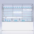 Medical Exhibition Hall with Glass Display Cabinet Blue Instruments White Counter and SCIENCE Signage