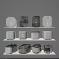 Modern Kitchen Appliances With Various Designs And Colors Displayed On White Shelves