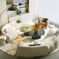 Modern Beige Curved Sofa and Glass Coffee Table Set With Decorative Vase and Floor Lamp