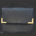 Black Leather Handbag With Gold Metal Accents Stylish Accessory For Daily Use