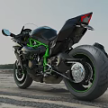 Stylish Black Sport Motorcycle With Green Frame Accents On Gravel Road Landscape