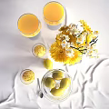 Fresh Lemon Flavored Drinks And Ice Cream With Decorative Flowers In Glassware