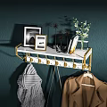 Modern Wall Mounted Coat Rack With Gold Hooks White Shelf Picture Frames And Flowers