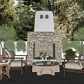 Outdoor Stone Fireplace With Burning Fire Rattan Chairs And Coffee Table In Garden