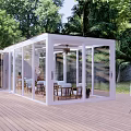 Spacious Glass Sunroom On Wooden Deck With Outdoor Tables Chairs And Green Trees