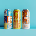 Three Colorful Canned Juice Drinks With Geometric Pattern Designs And Vibrant Labels
