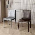 Gray And Dark Brown Leather Dining Chairs With White Brick Wall Wooden Floor And Plant
