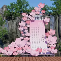 Floral Art Installation With Pink Cherry Blossoms Rocky Background And Green Trees