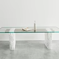 Glass Top Dining Table With Stone Legs Featuring Magazine And Minimalist Interior Decor