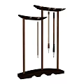 Three Elegant Calligraphy Brushes Hanging On Traditional Wooden Stands