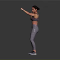 Woman Practicing Boxing Stance In Gray Sports Bra And Leggings