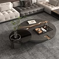 Modern Sectional Sofa with Gray Leather Upholstery Round Coffee Table and Decorative Pillows
