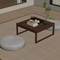 Japanese Style Wooden Tea Table with Round Floor Cushions Tea Set Books and Green Plant